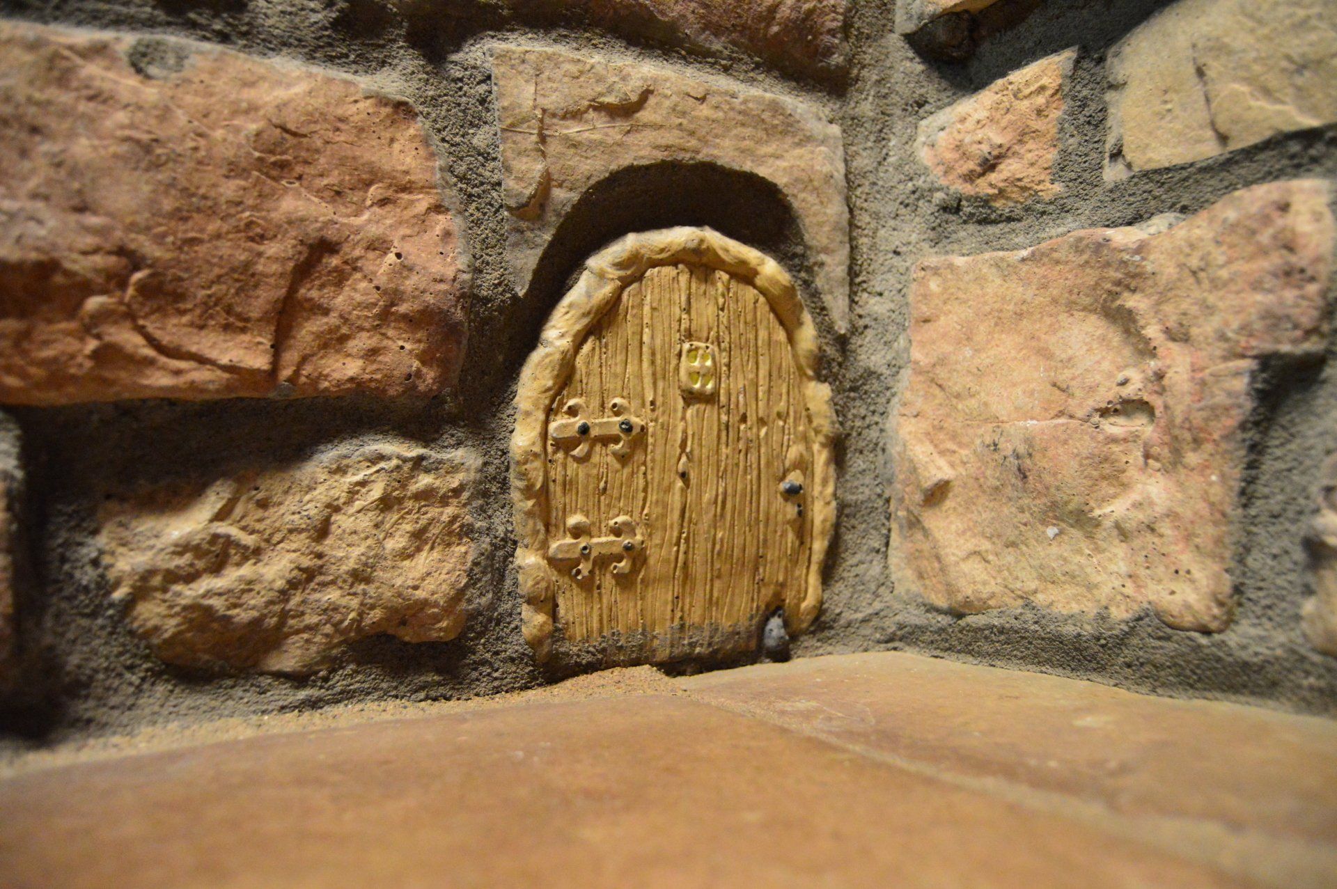 Mouse Doors manufactured stone veneer